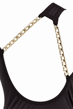 One-shoulder maxi dress with an open back and chain details
