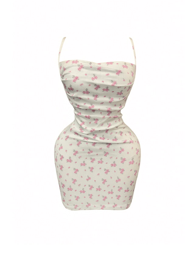 دريس قصير بطبعه الزهور ومزود بقصه من الضهر